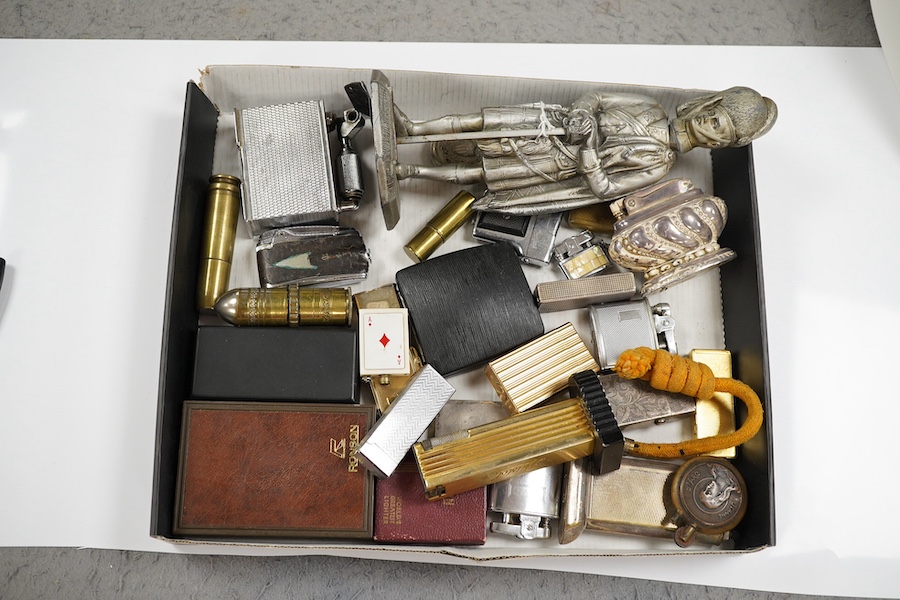 A collection of assorted cigarette lighters, including a large figural lighter, largest 23cm high. Condition - variable